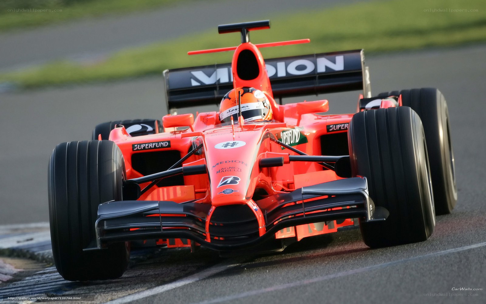 orange formula one car on track