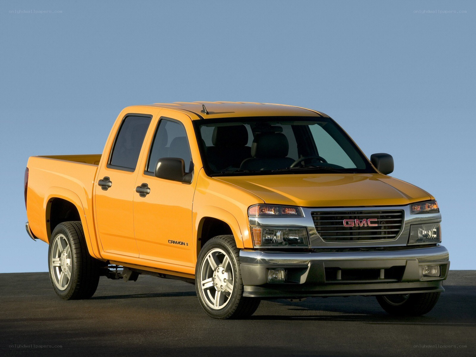 Orange GMC Canyon pickup truck