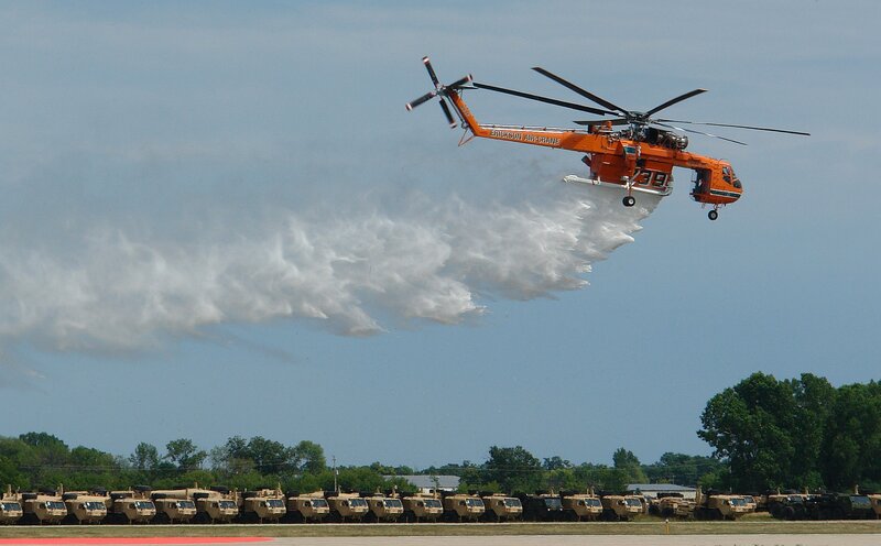 Orange Helicopter Dropping Water