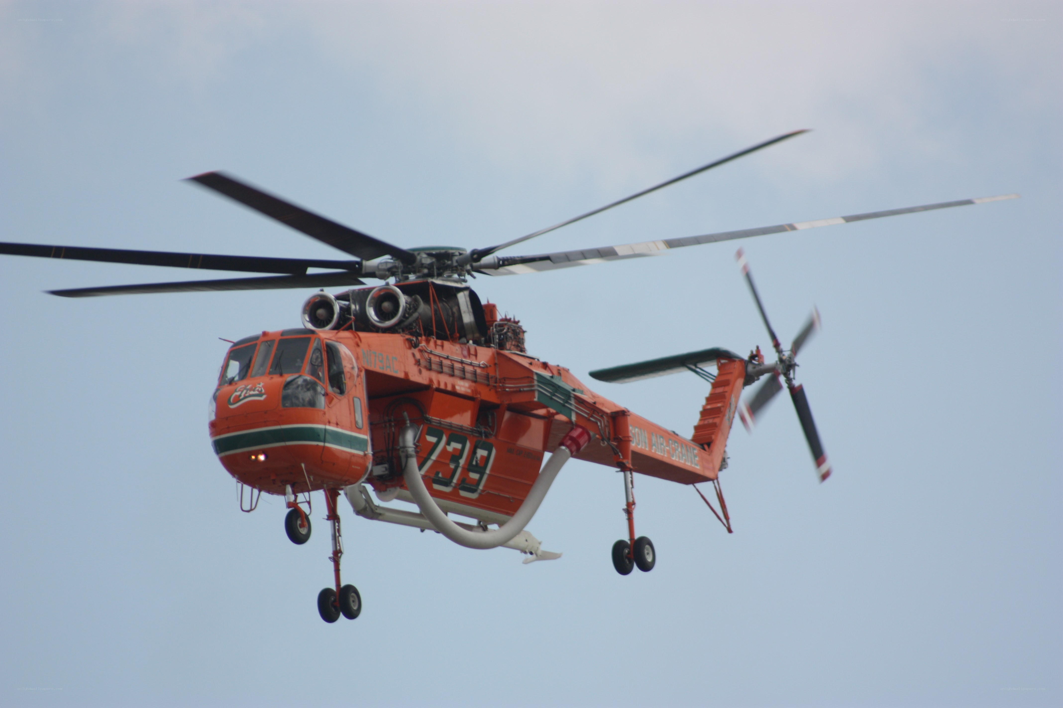 orange helicopter in flight