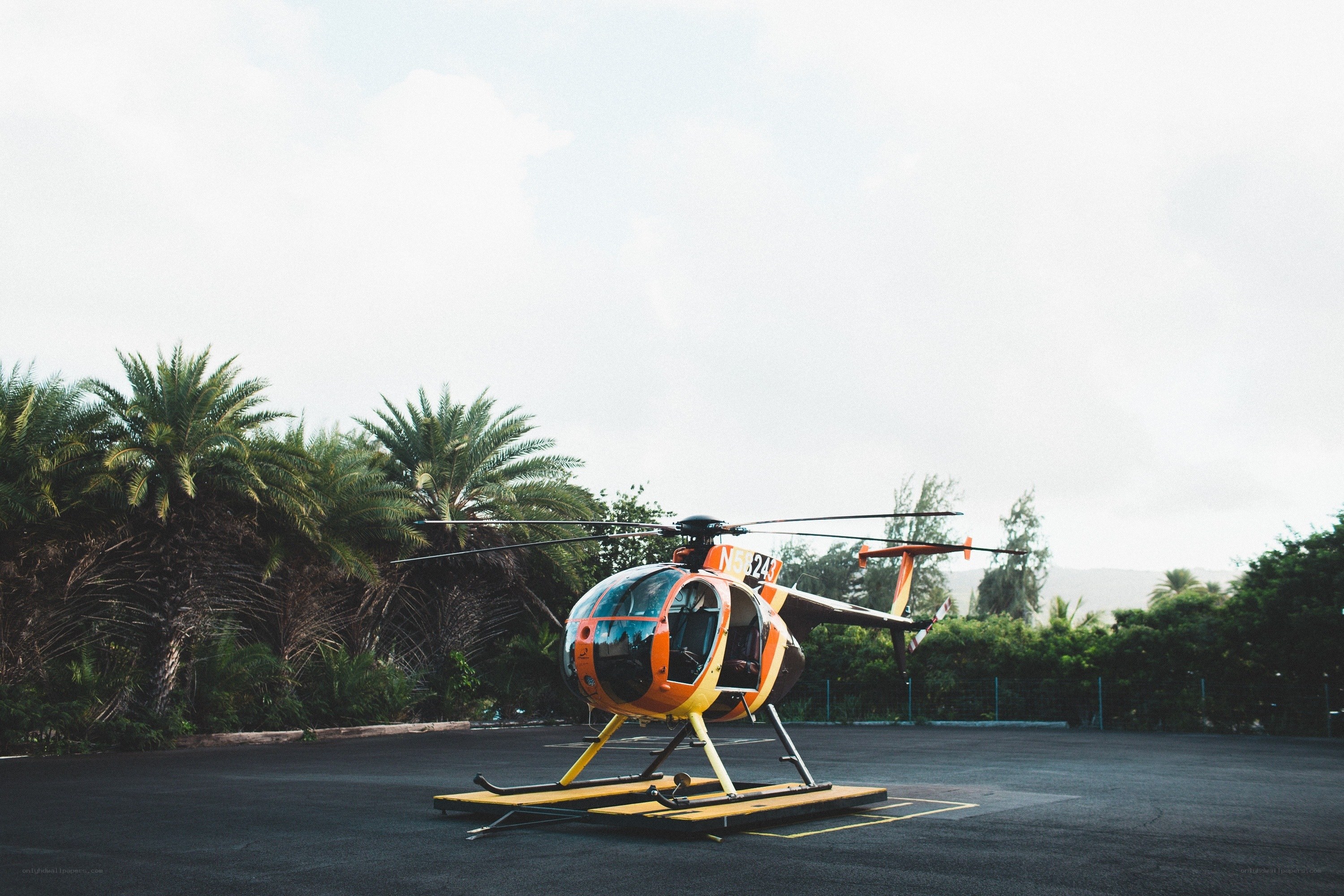 Orange helicopter on tarmac