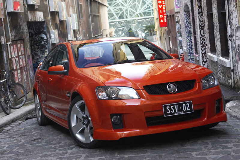 Orange Holden in a graffiti alley