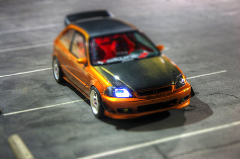 orange honda civic in parking lot