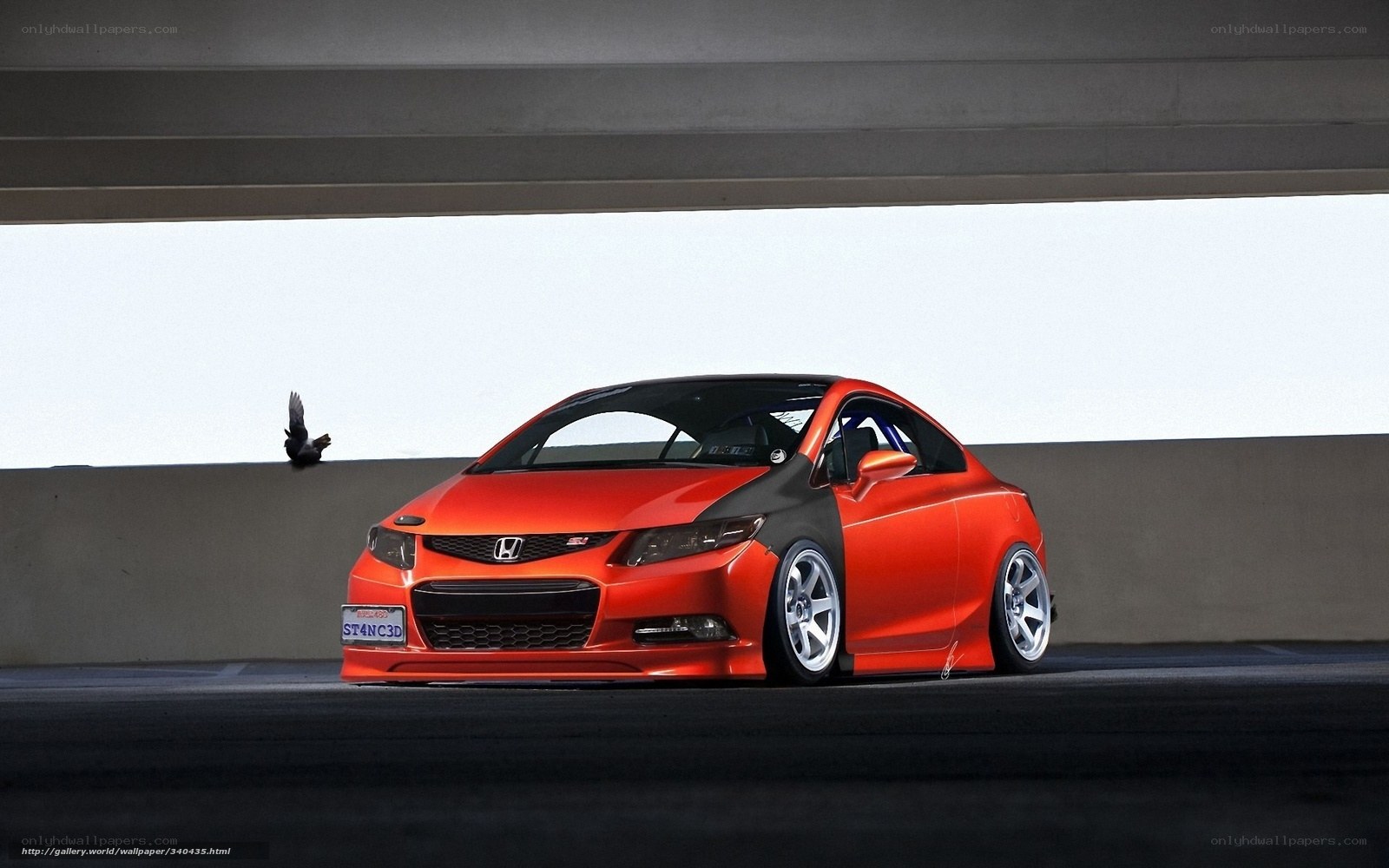Orange Honda Civic under overpass