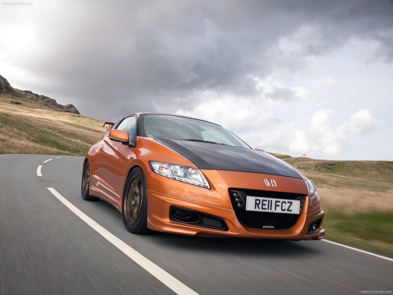 Orange Honda CR-Z driving on road