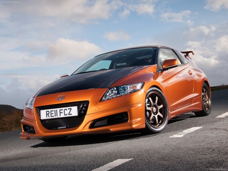 Orange Honda CR-Z on a road