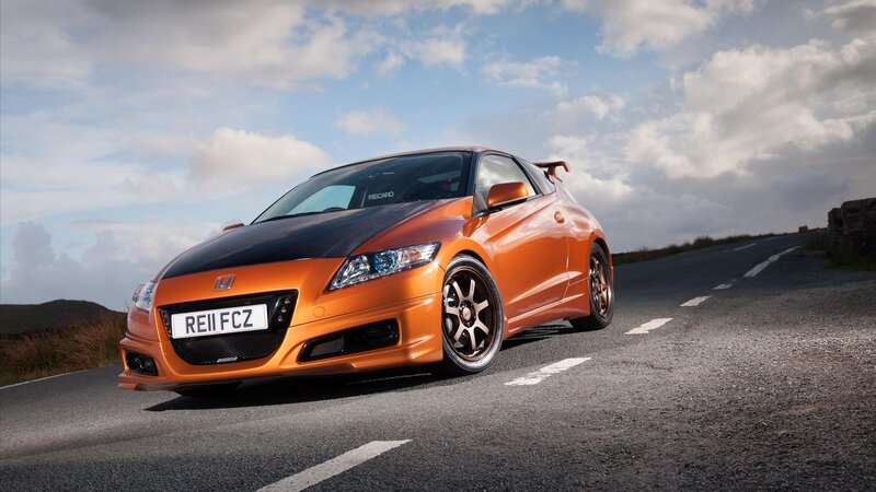 Orange Honda CR-Z on a road