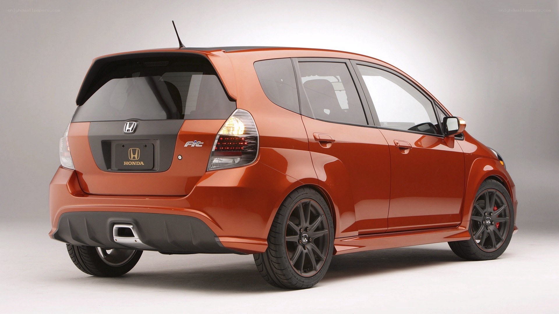Orange Honda Fit car