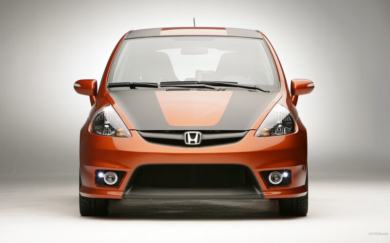 orange honda hatchback car