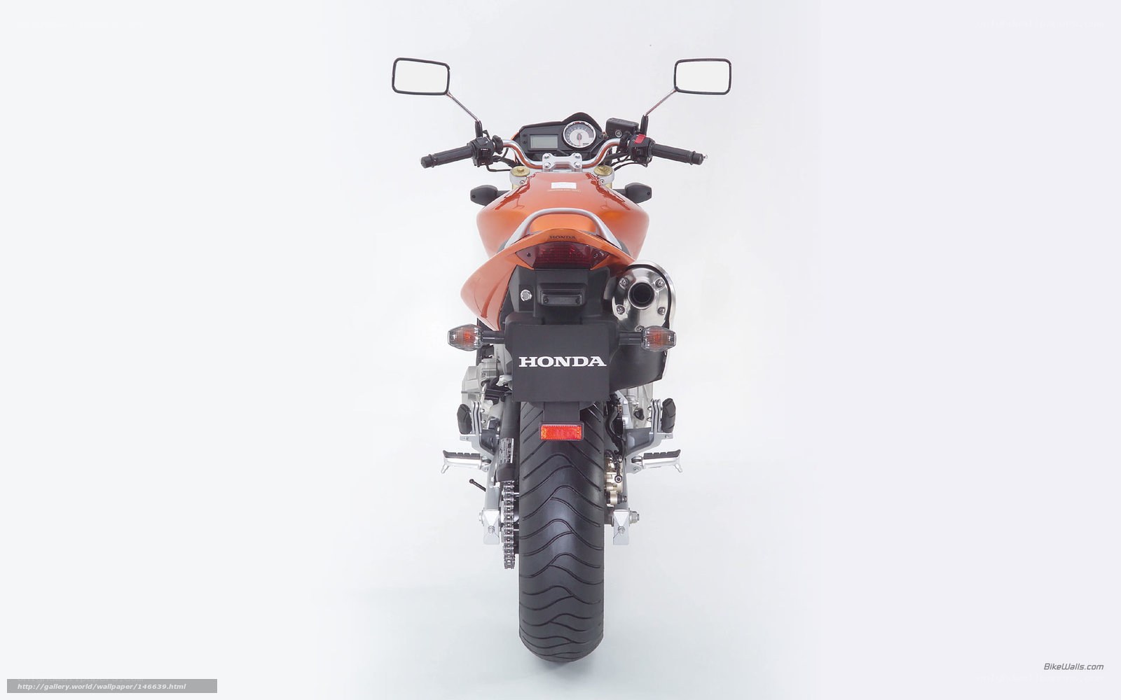 orange honda motorcycle rear view