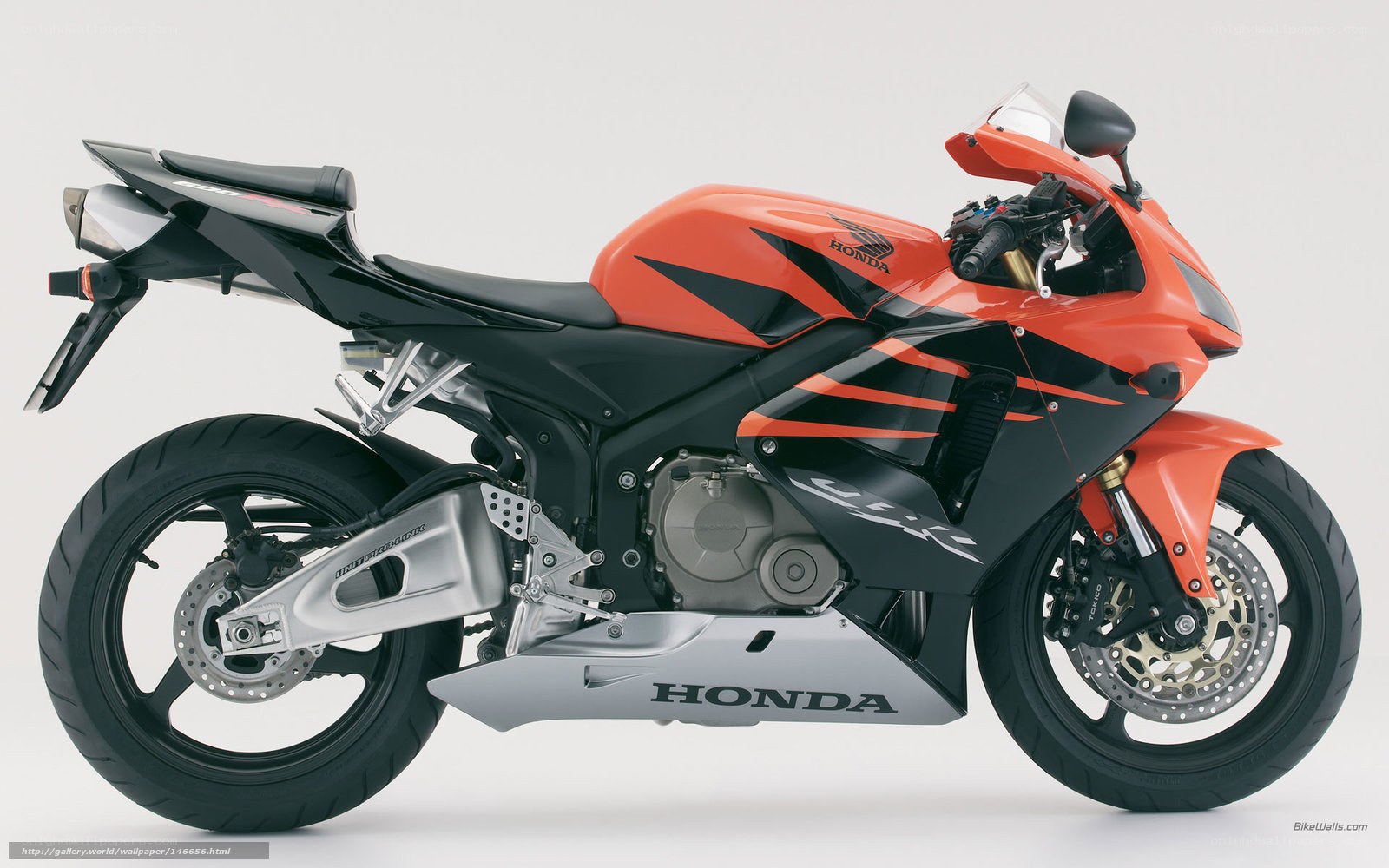 Orange Honda sport motorcycle