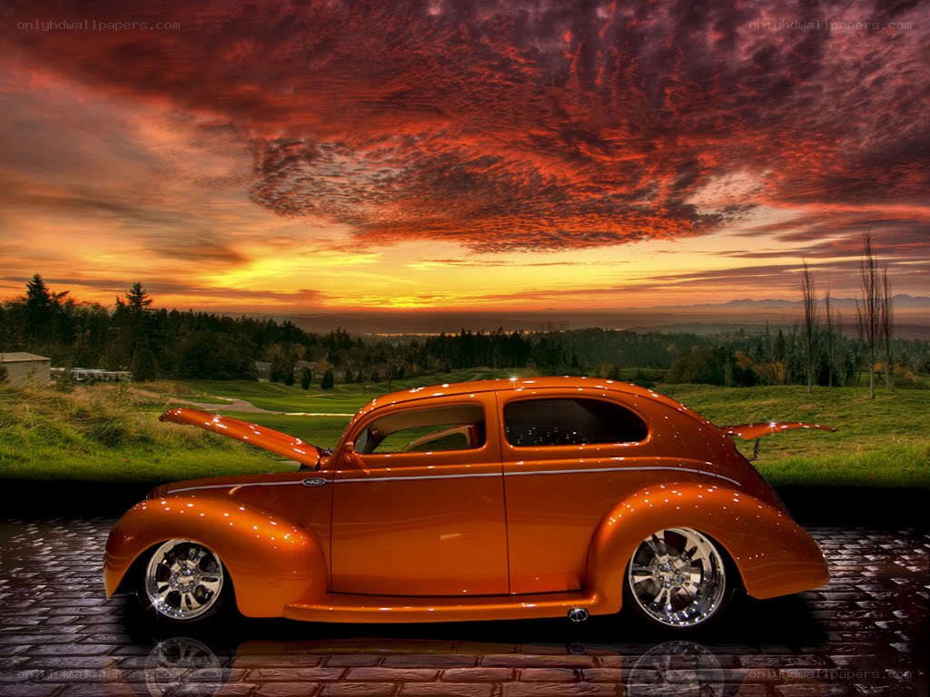 Orange hot rod at sunset