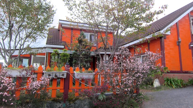 Orange House with Fence