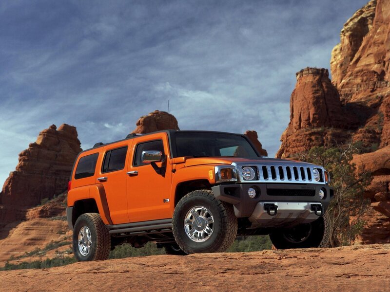Orange Hummer H3 in desert
