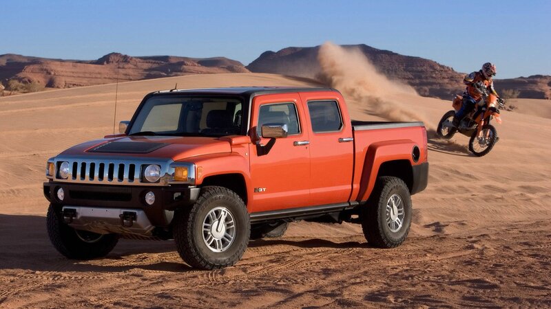 Orange Hummer H3 in desert