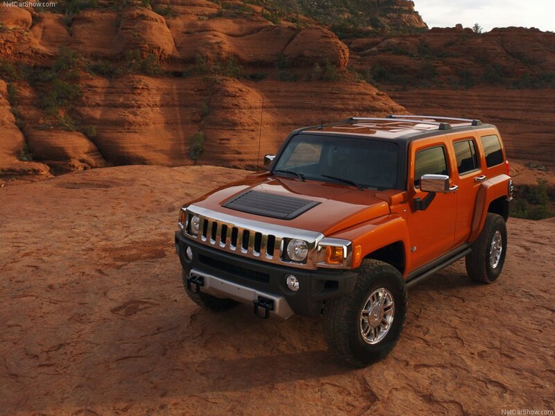 Orange Hummer H3 in desert