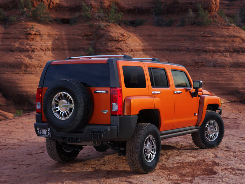Orange Hummer H3 in desert