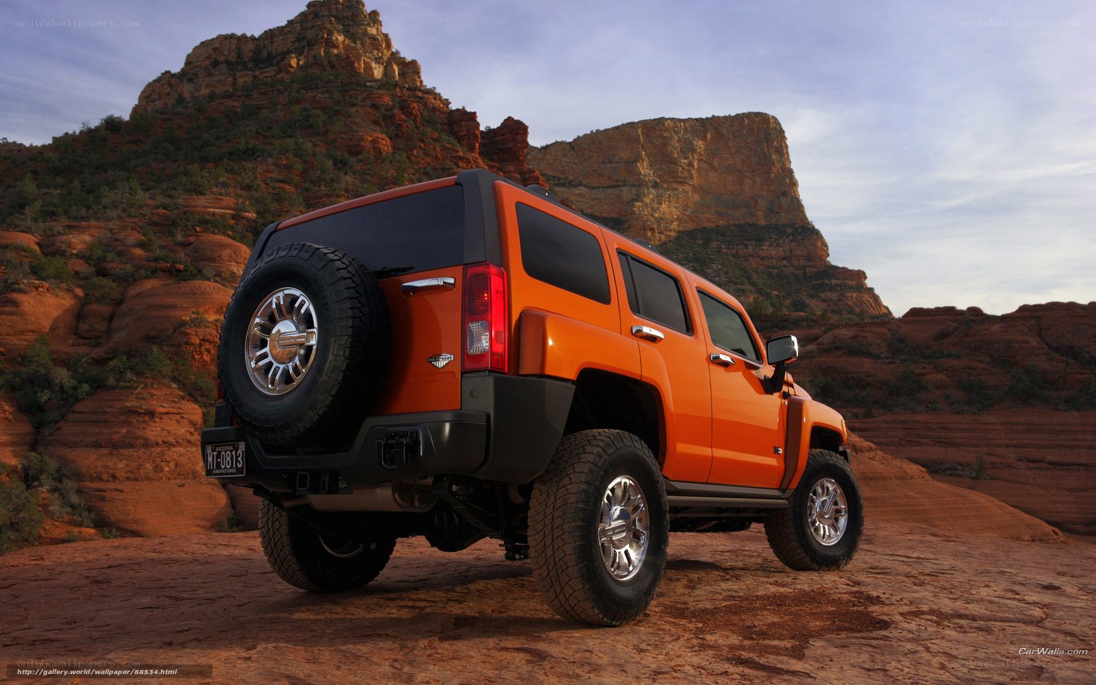 Orange Hummer H3 in desert