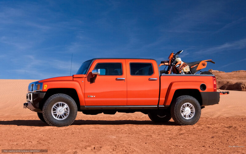 Orange Hummer H3T in desert