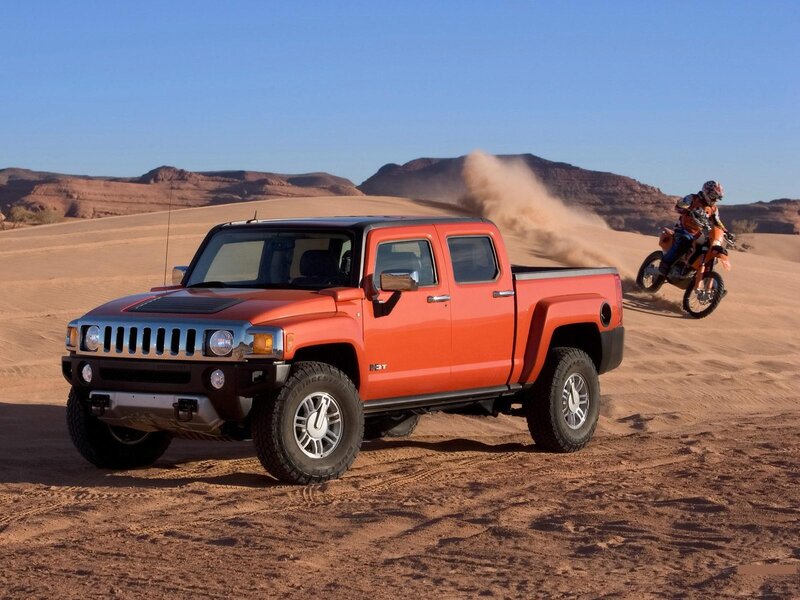 Orange Hummer H3T in desert
