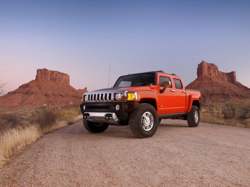Orange Hummer H3T in desert