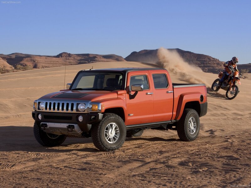 Orange Hummer H3T in desert