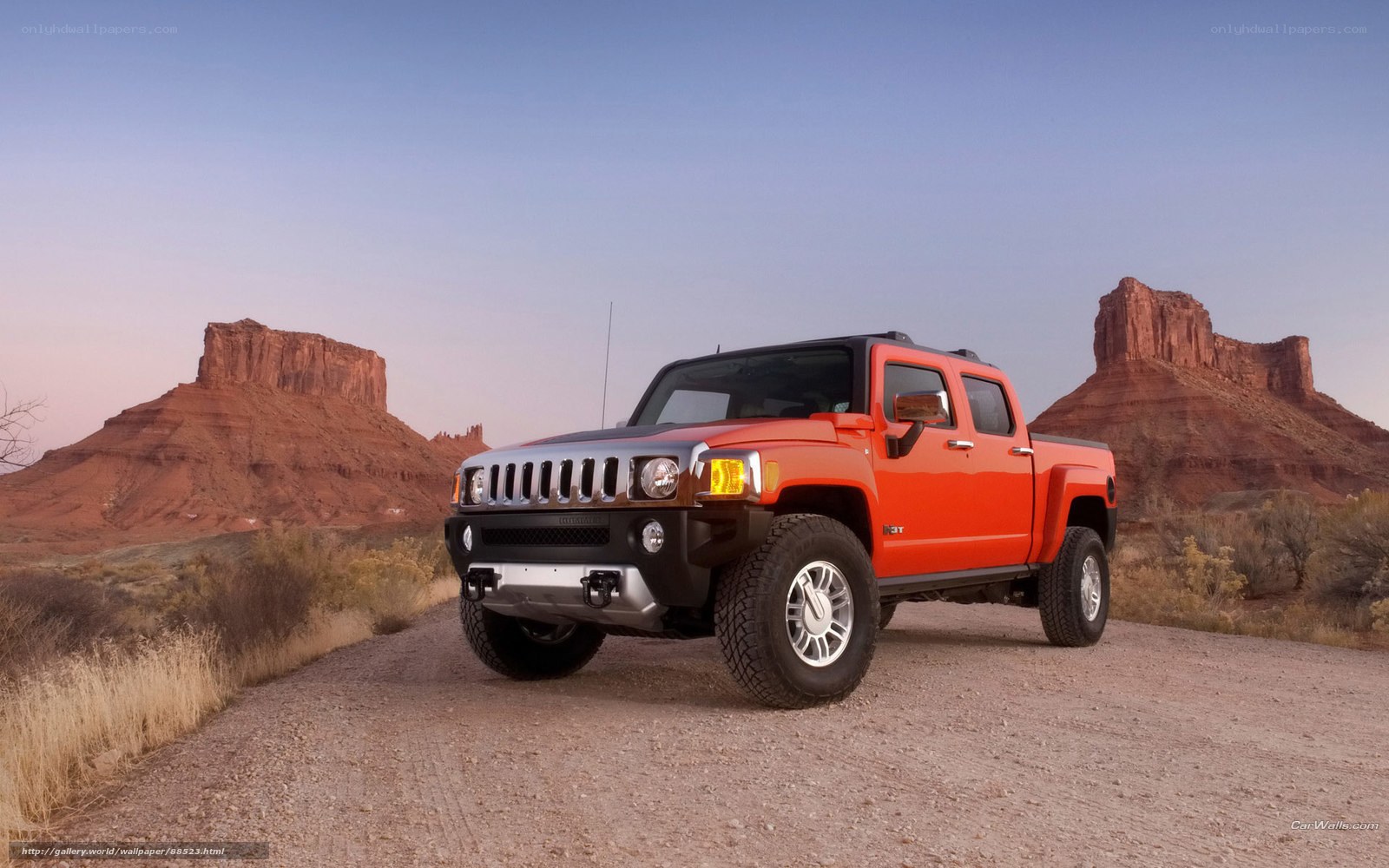 Orange Hummer H3T in desert