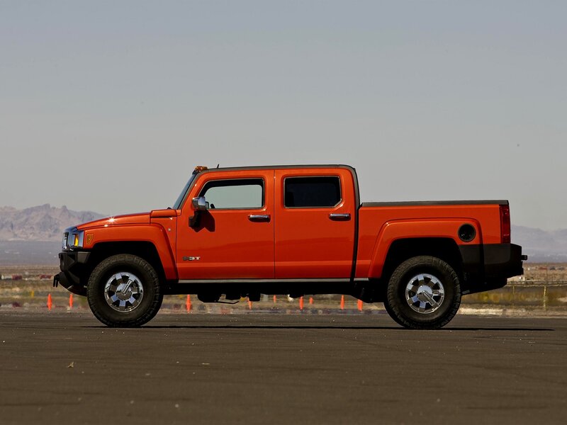 Orange Hummer H3T pickup truck