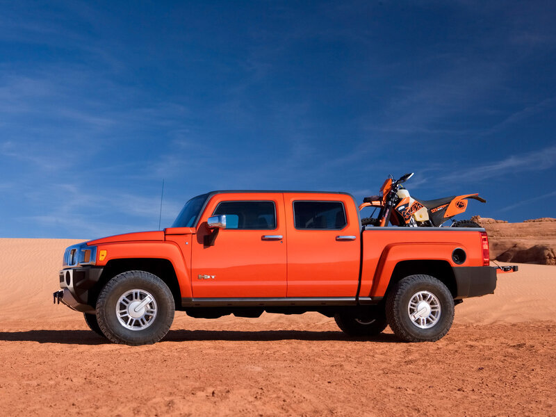Orange Hummer H3T pickup truck