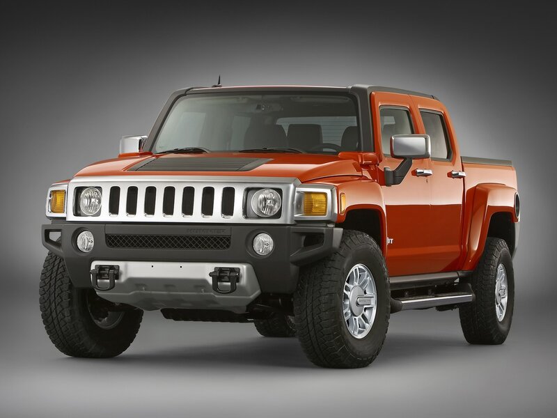 Orange Hummer H3T pickup truck