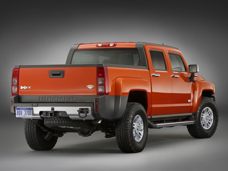 Orange Hummer H3T pickup truck
