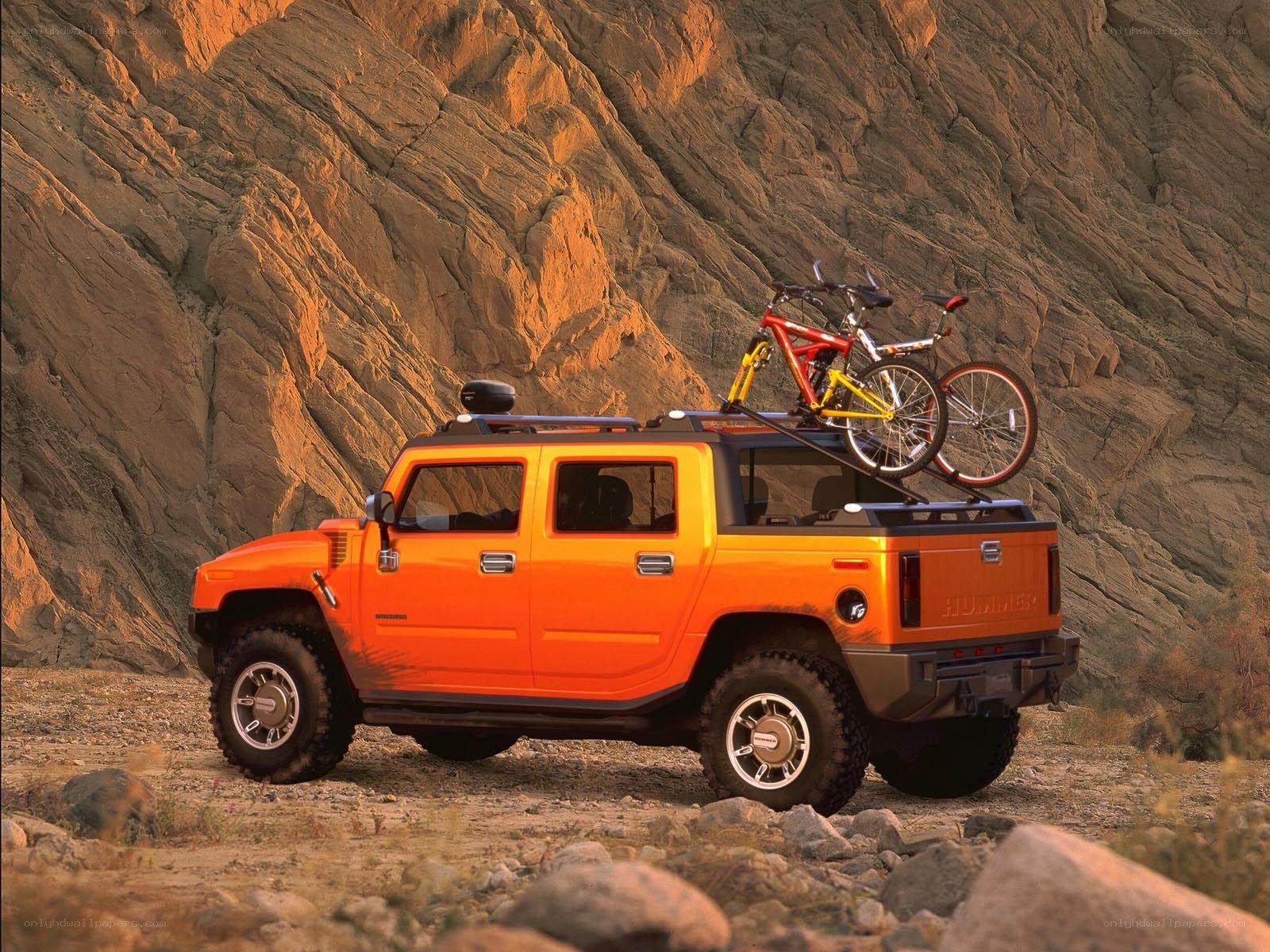 Orange Hummer with bikes