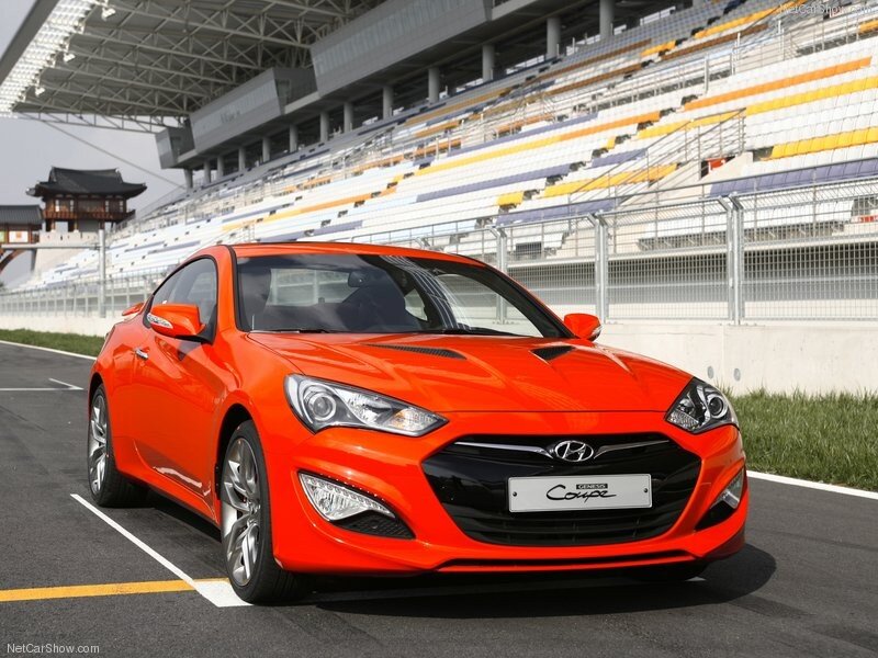 Orange Hyundai Coupe on a racetrack