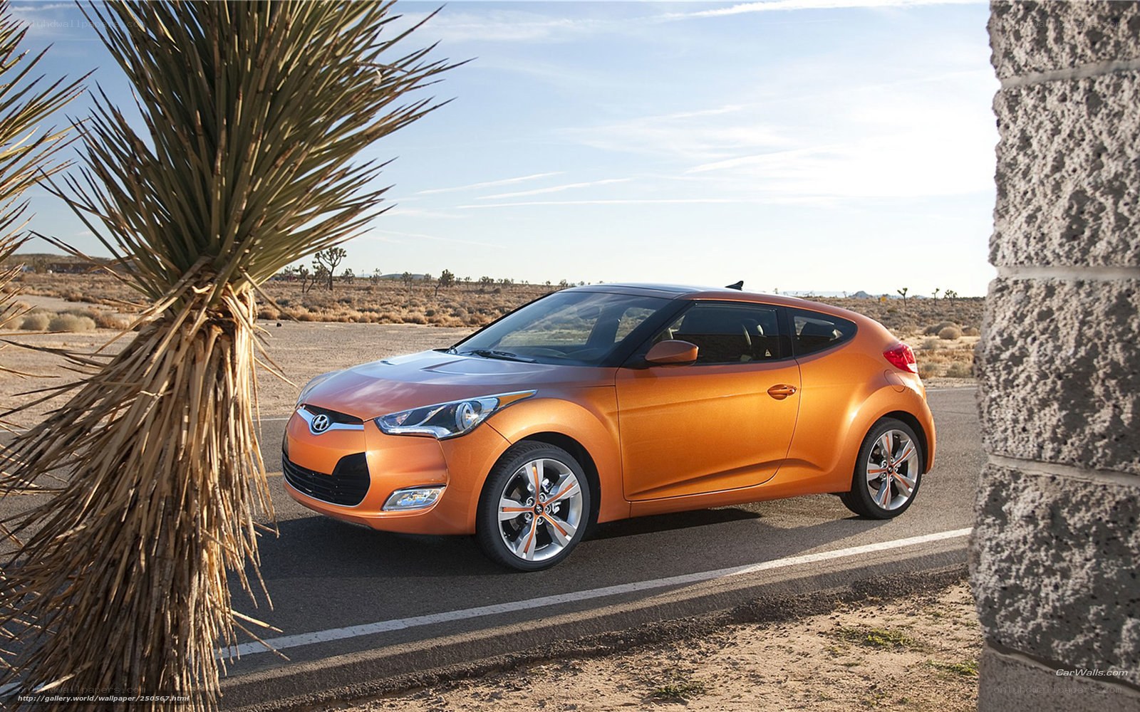 Orange Hyundai Veloster in desert