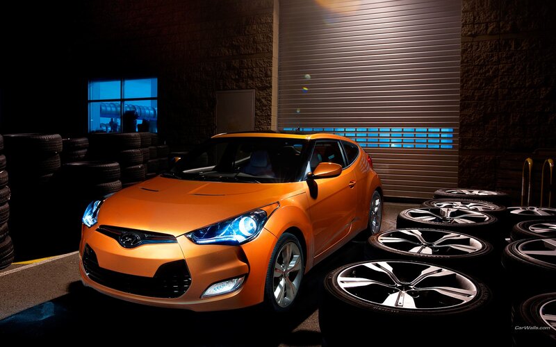 Orange Hyundai Veloster in garage
