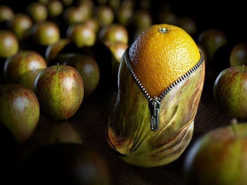 orange in apple-shaped pouch