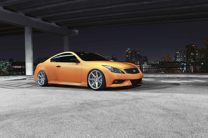 Orange Infiniti G37 under bridge