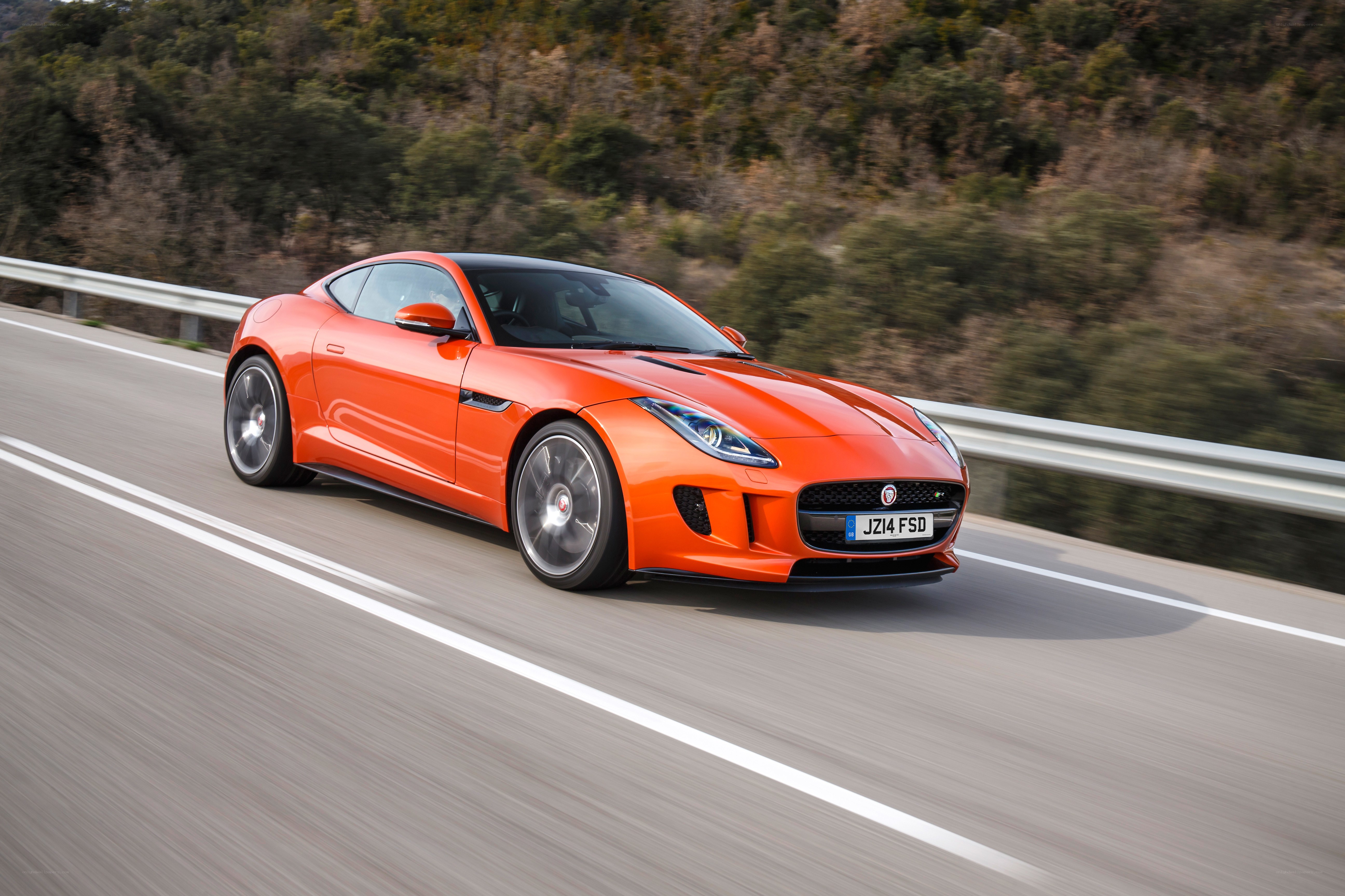 Orange Jaguar F-Type in motion