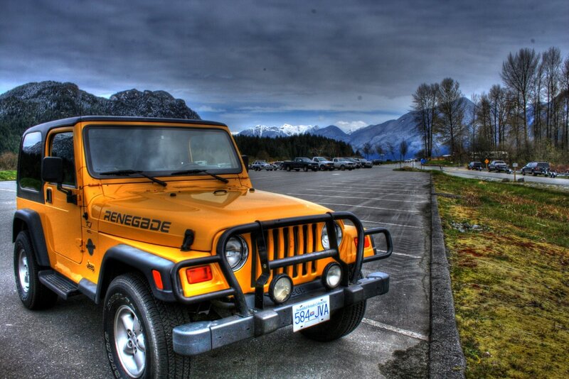 Orange Jeep in a parking lot