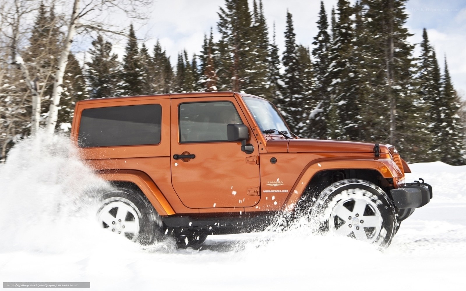 Orange Jeep in Snowy Forest