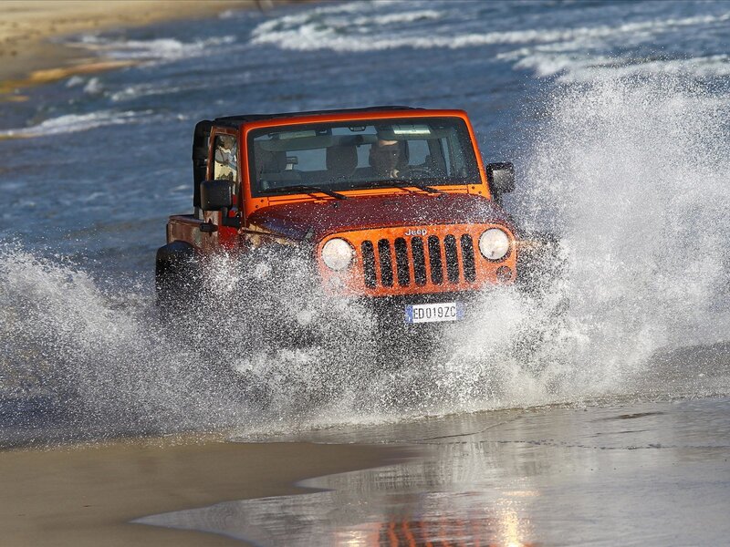 Orange Jeep on Beach