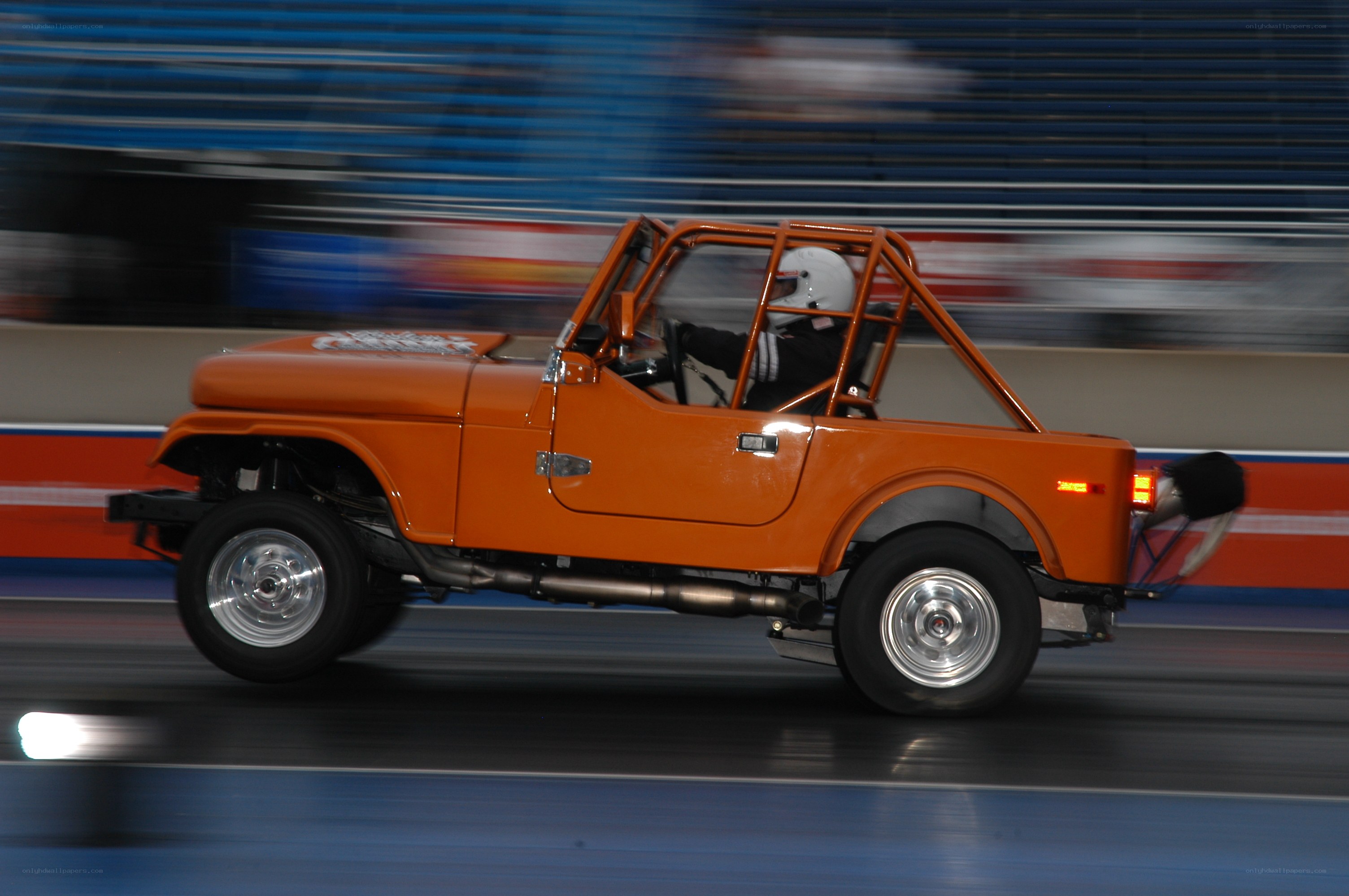 Orange Jeep Racing on Track