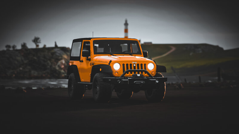 Orange Jeep Wrangler — Dramatic, Night
