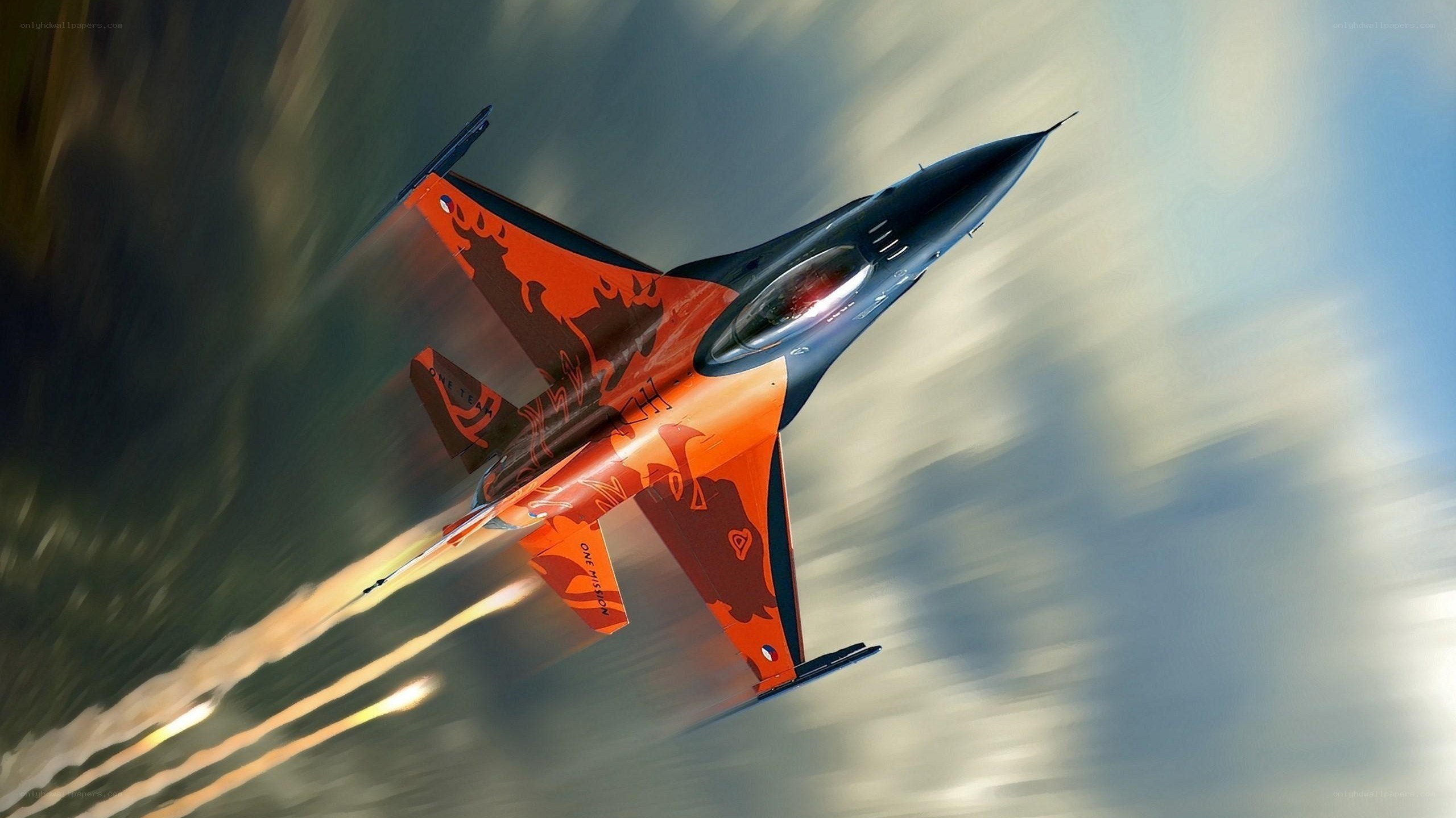 Orange jet fighter in flight