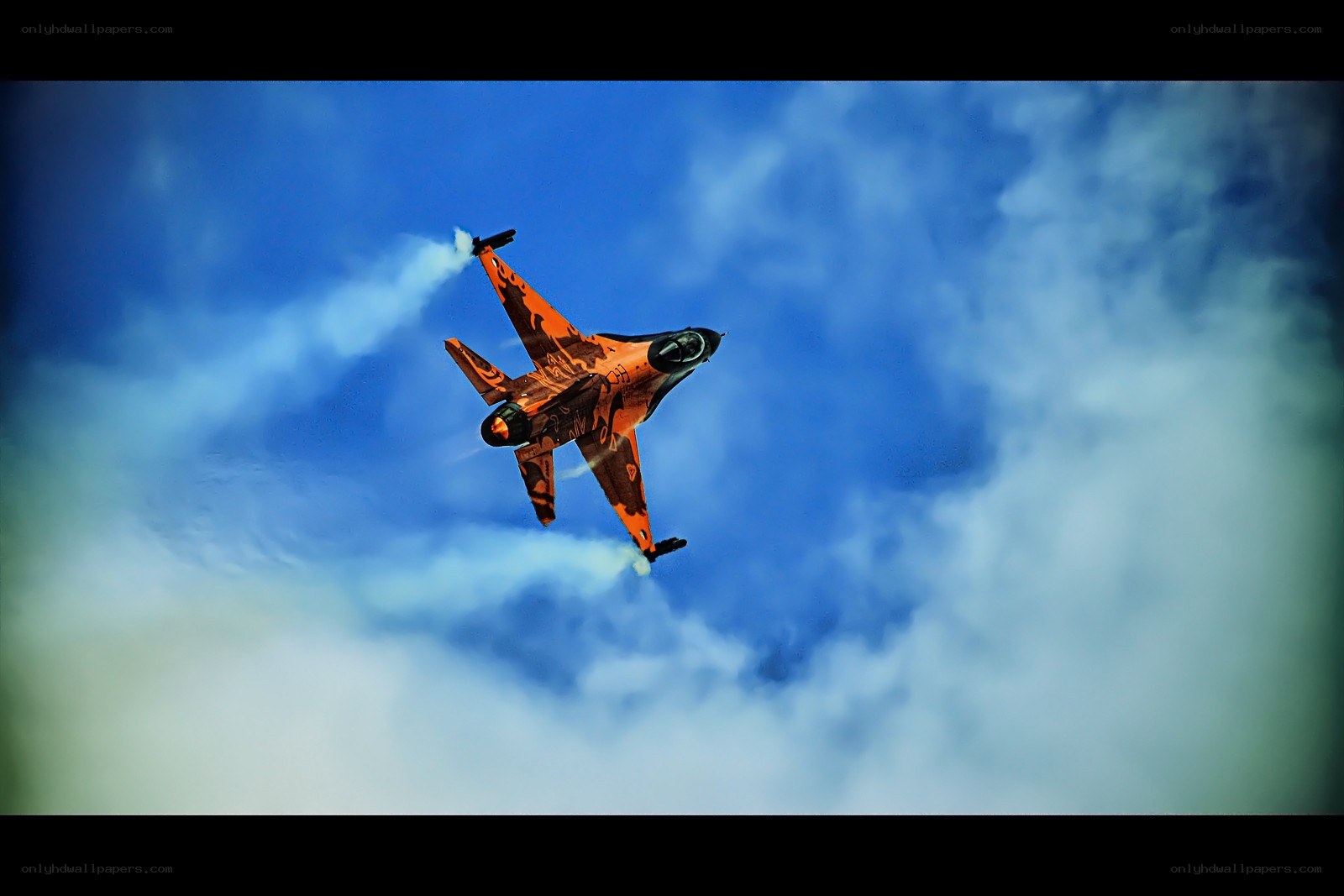 orange jet performing aerobatics