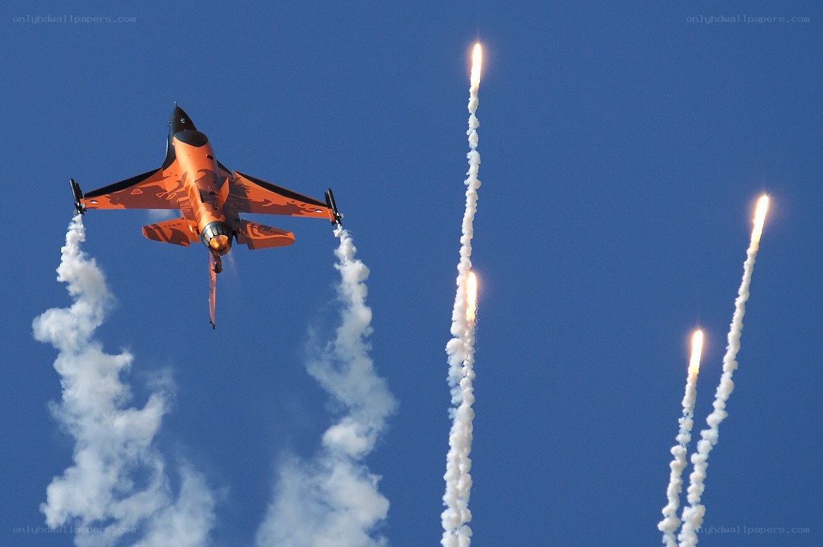 Orange jet releasing flares