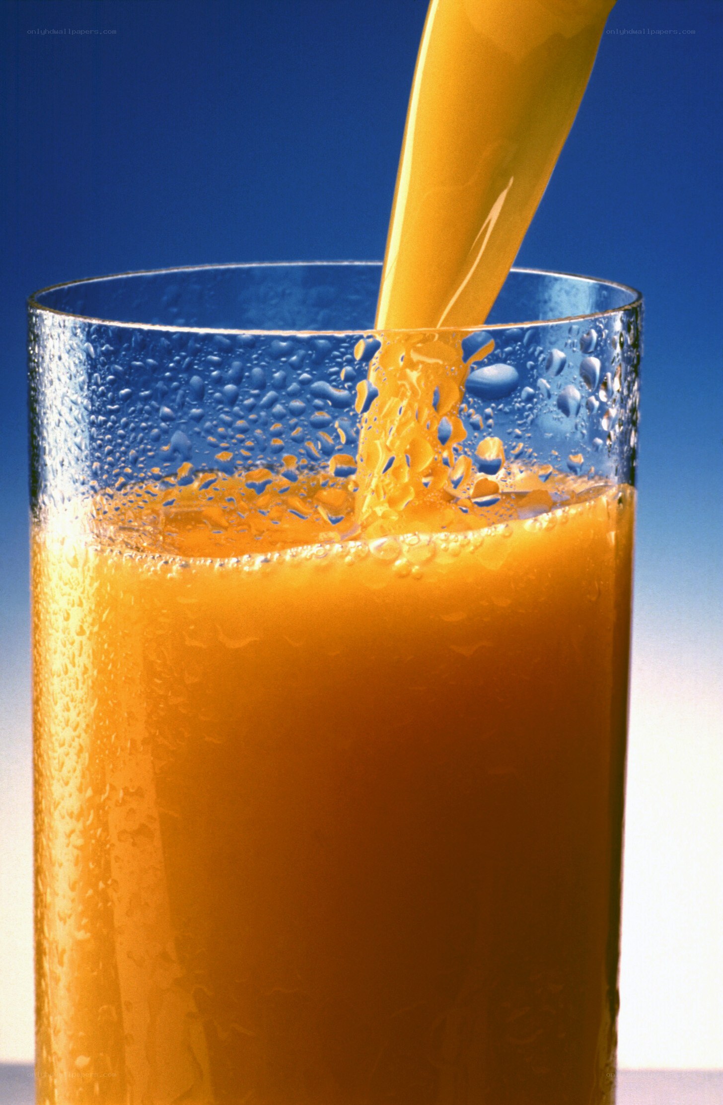orange juice being poured