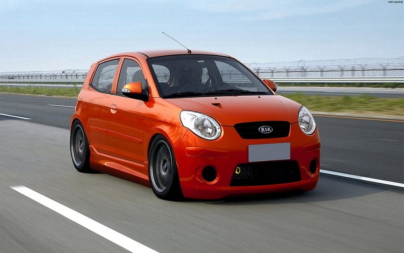 orange kia car on road