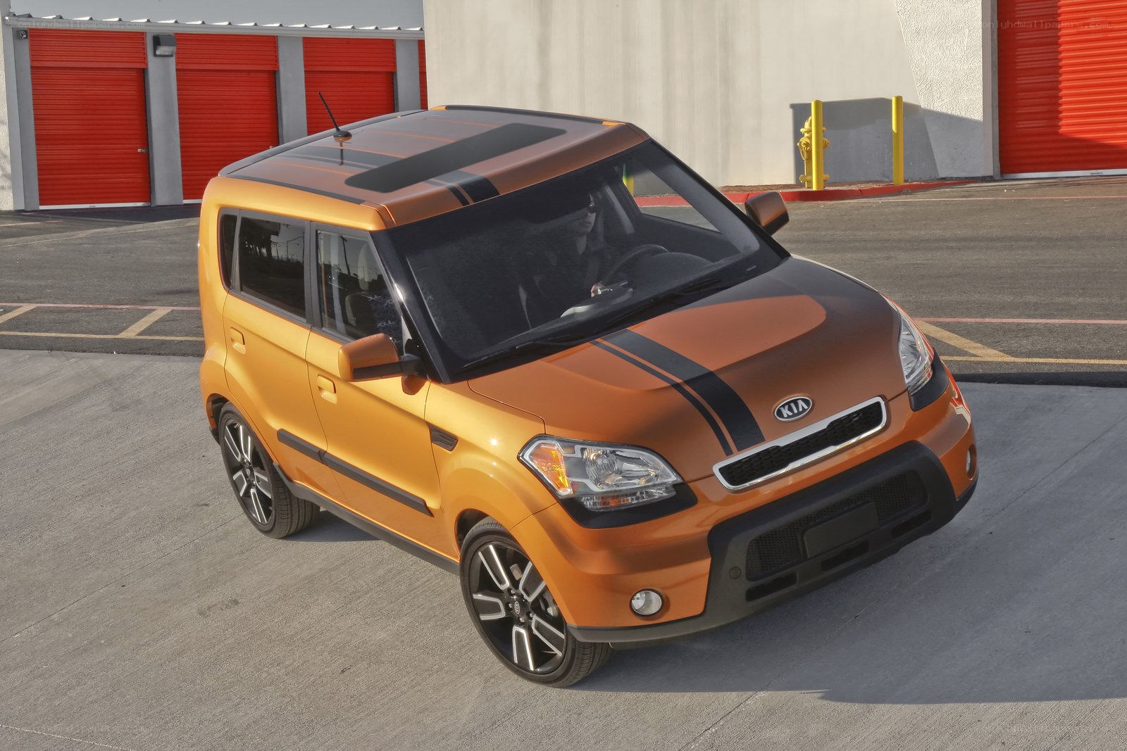 Orange Kia Soul with stripes