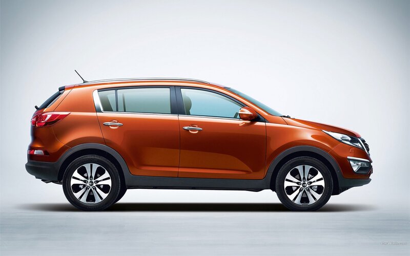 orange kia sportage suv
